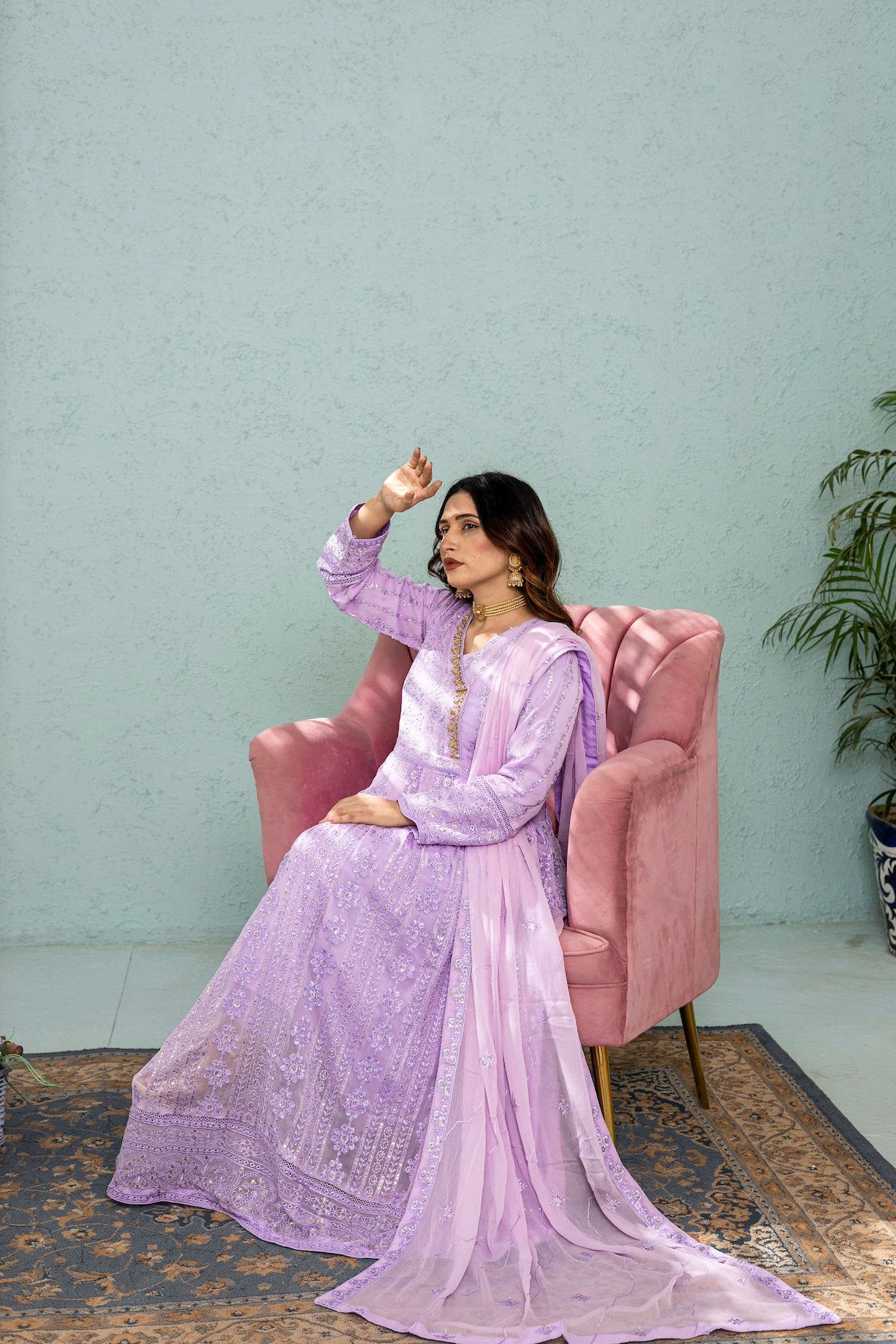 Model posing in Lilac long frock