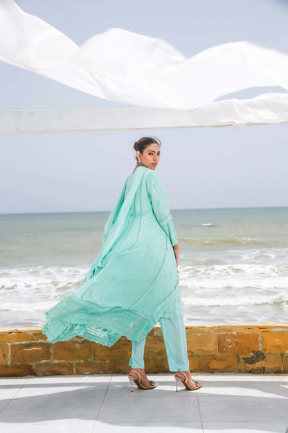 Back profile of model in blue formal gown dress