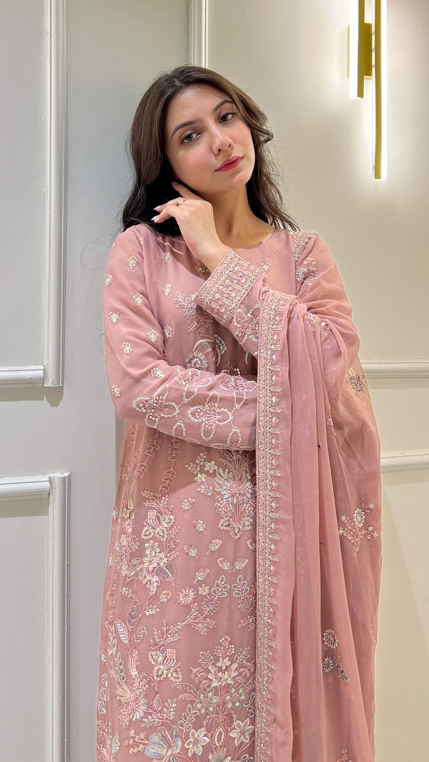 Close-up of floral embroidery on peach  shirt and dupatta